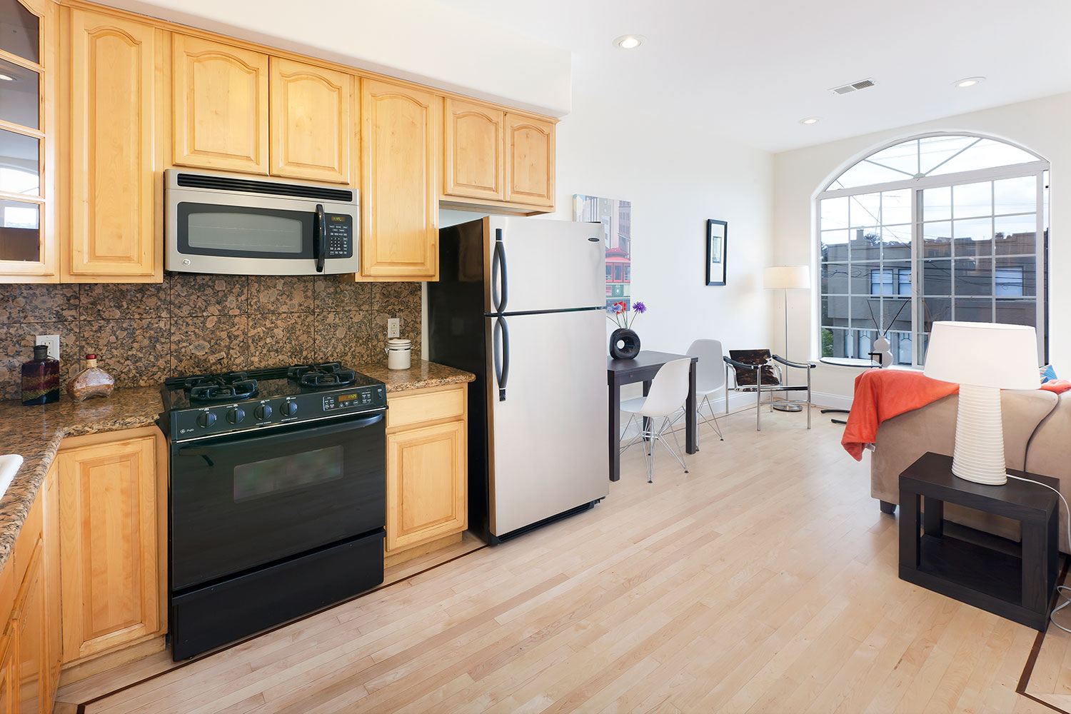 Interior kitchen and dining room. Two bedroom condominium in the Mission District of San Francisco.