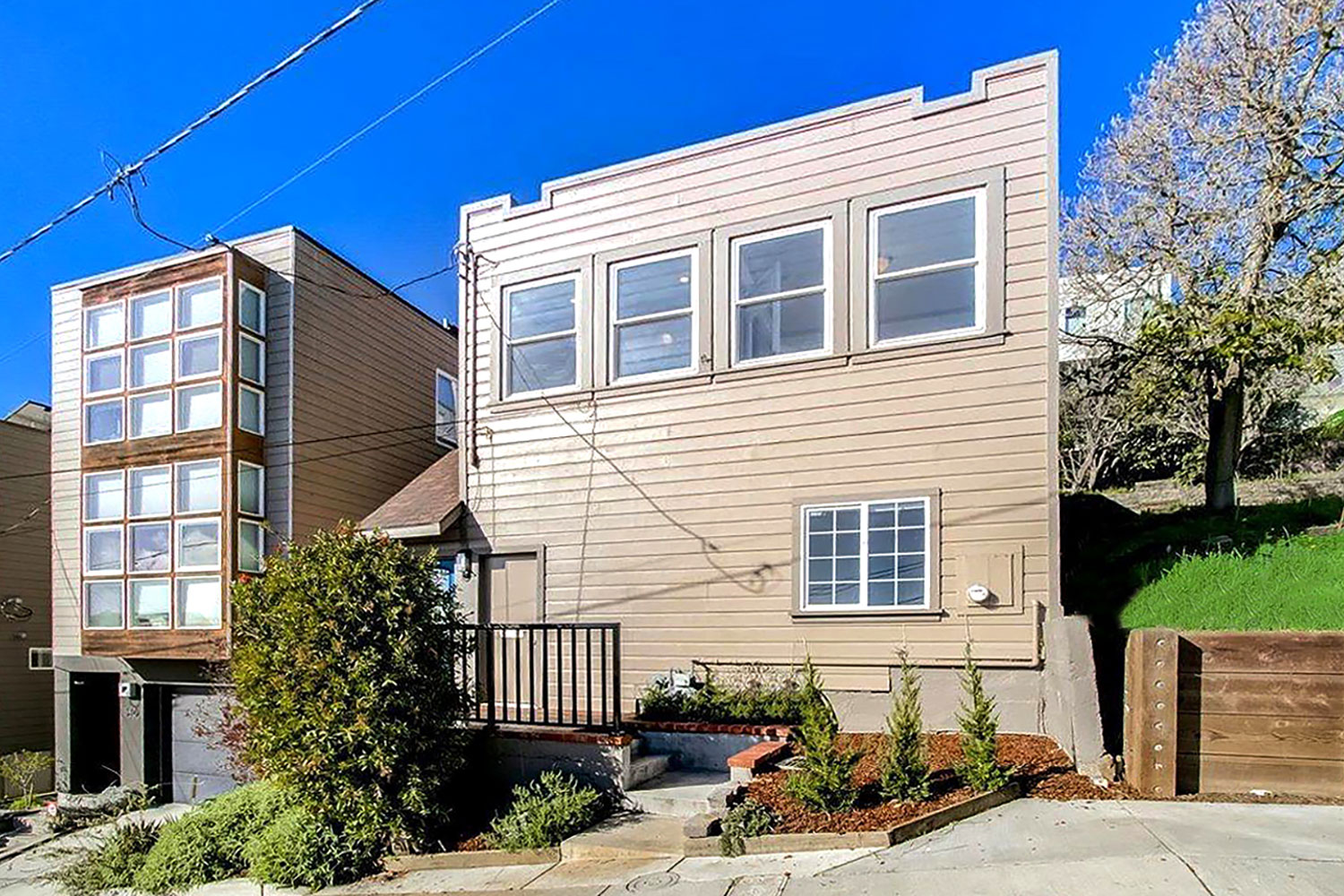 Renovated 2-story single family home in Bernal Heights. Landscaped walk-up entry. Exterior painted beige.